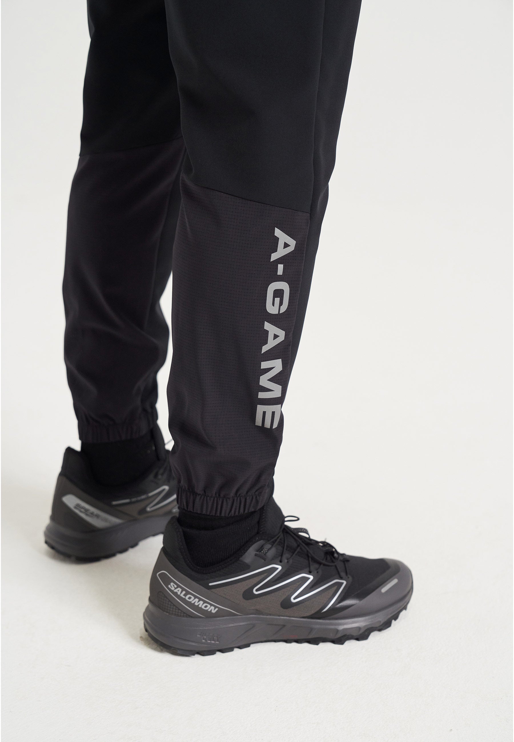 PANTALON D'ENTRAÎNEMENT À REVÊTEMENTS A-GAME POUR HOMMES - NOIR